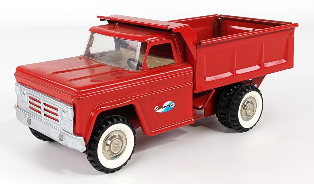 Original Structo Dump Truck: Original Structo manual dump truck. Good condition with minimal play wear. Measures approximately 14" long.
