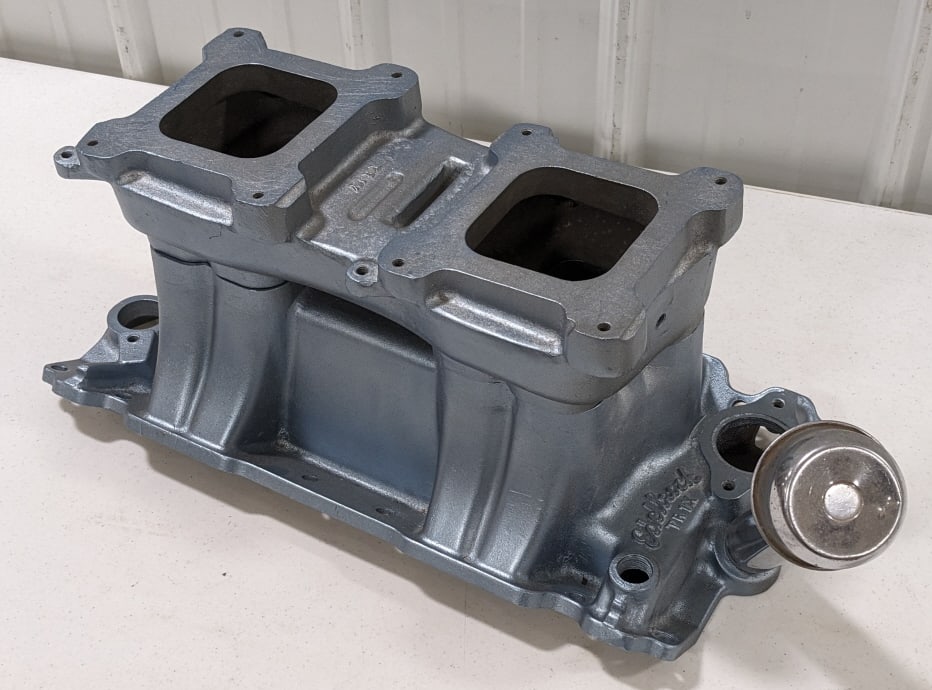 Reproduction Edelbrock TR1X Tunnel Ram Intake: Reproduction Edelbrock TR1X tunnel ram intake. Good condition overall. Measures approximately 23" across.
