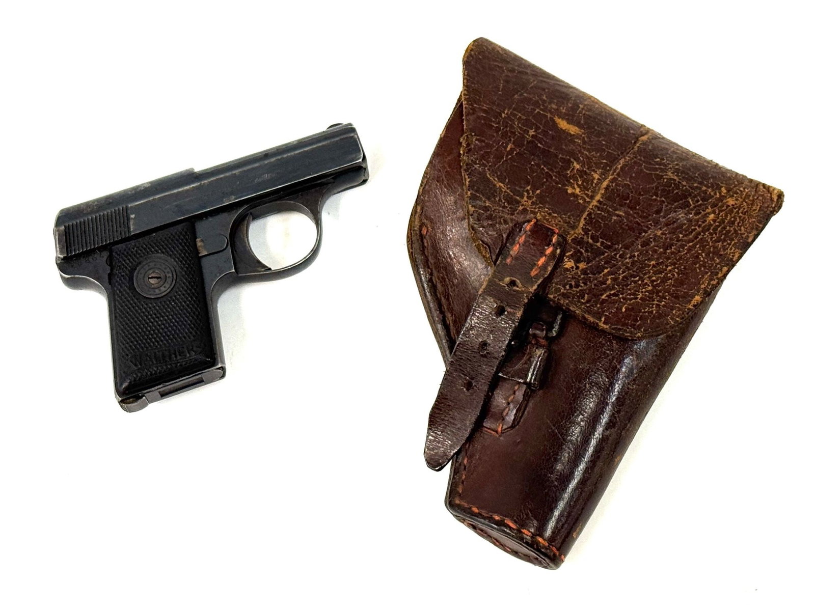 German Walther Model 9 .25 Auto Semi-Auto Pistol in Holster: German Walther Model 9 .25 Auto Semi-Auto Pistol in Holster.? The German Walther Model 9 Pistol is in used condition.? Barrel measures 2 inches in length.? Blueing is thin in some areas and some pitti