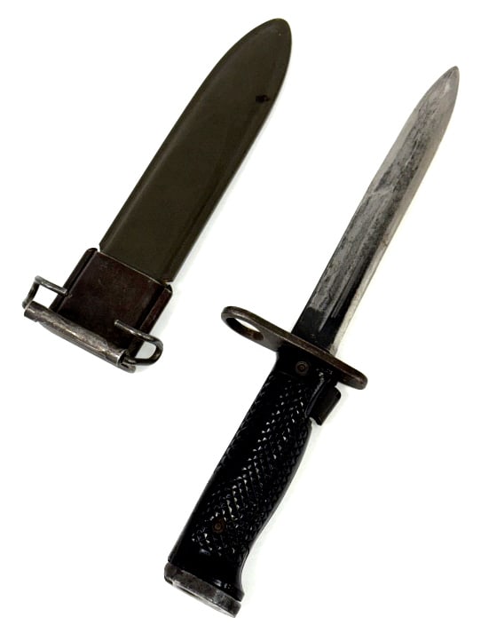 US M5 Milpar Col Bayonet w Scabbard: US M5 Milpar Col Bayonet w Scabbard. The US M5 bayonet w scabbard is in used condition. Blade measures 6 7/8 inches in length. One of the black plastic grips has a crack. Scabbard reads USN MK1. Scabb