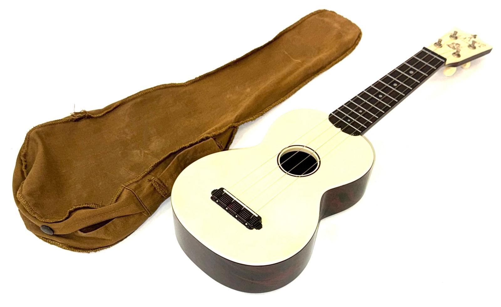 Islander Ukulele by Maccaferri with Cloth Bag: Islander Ukulele by Maccaferri with Cloth Bag.? The islander Ukulele is in very nice used condition.? Ukulele measures 21 inches in length.? This is a plastic ukulele from the 1950's. The cloth bag fi