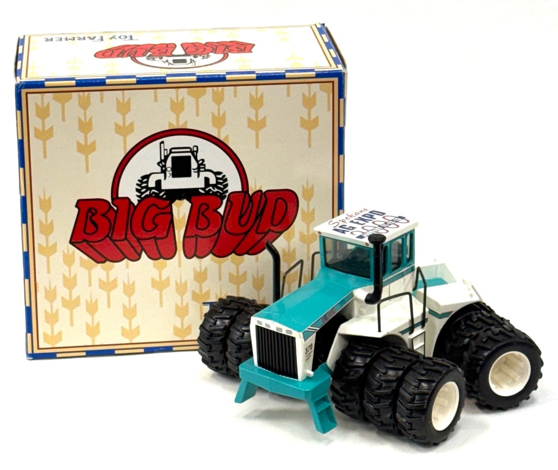 1:32 ERTL Toy Farmer BIG BUD 370 Bafus Blue Tractor: 1:32 ERTL Toy Farmer BIG BUD 370 Bafus Blue Tractor with Triple Wheels and Articulating Body.? (2000 Spokane AG Expo Edition) (Item# 3436Q). This tractor comes with the original box and displays nicel