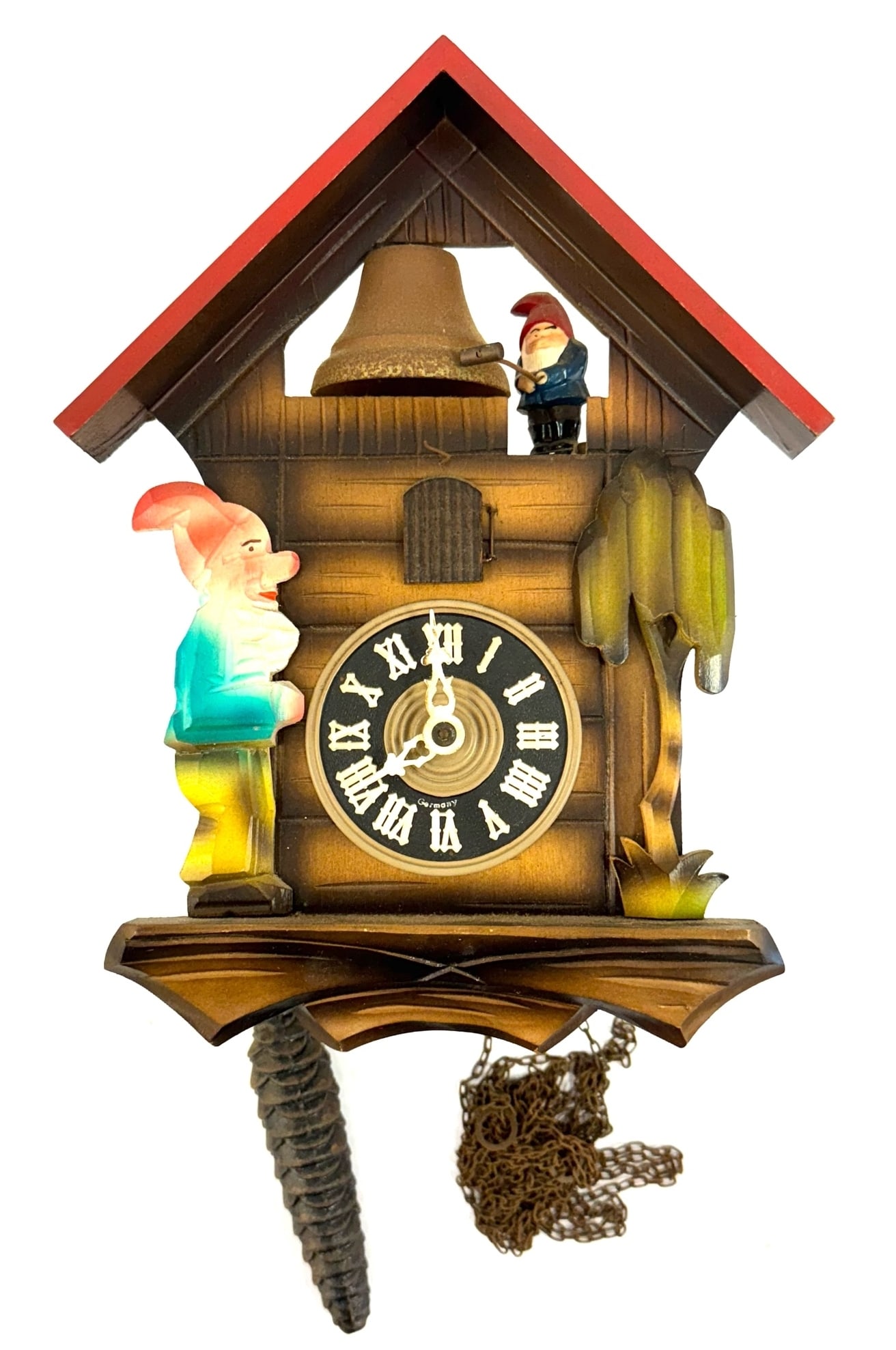 German Timber Gnome Cuckoo Clock: German Timber Gnome Cuckoo Clock. The German Timber clock is in very nice used condition. Clock measures 11 x 8 inches. Two gnome figures on clock, the blue and white plastic cuckoo is present. Gnomes