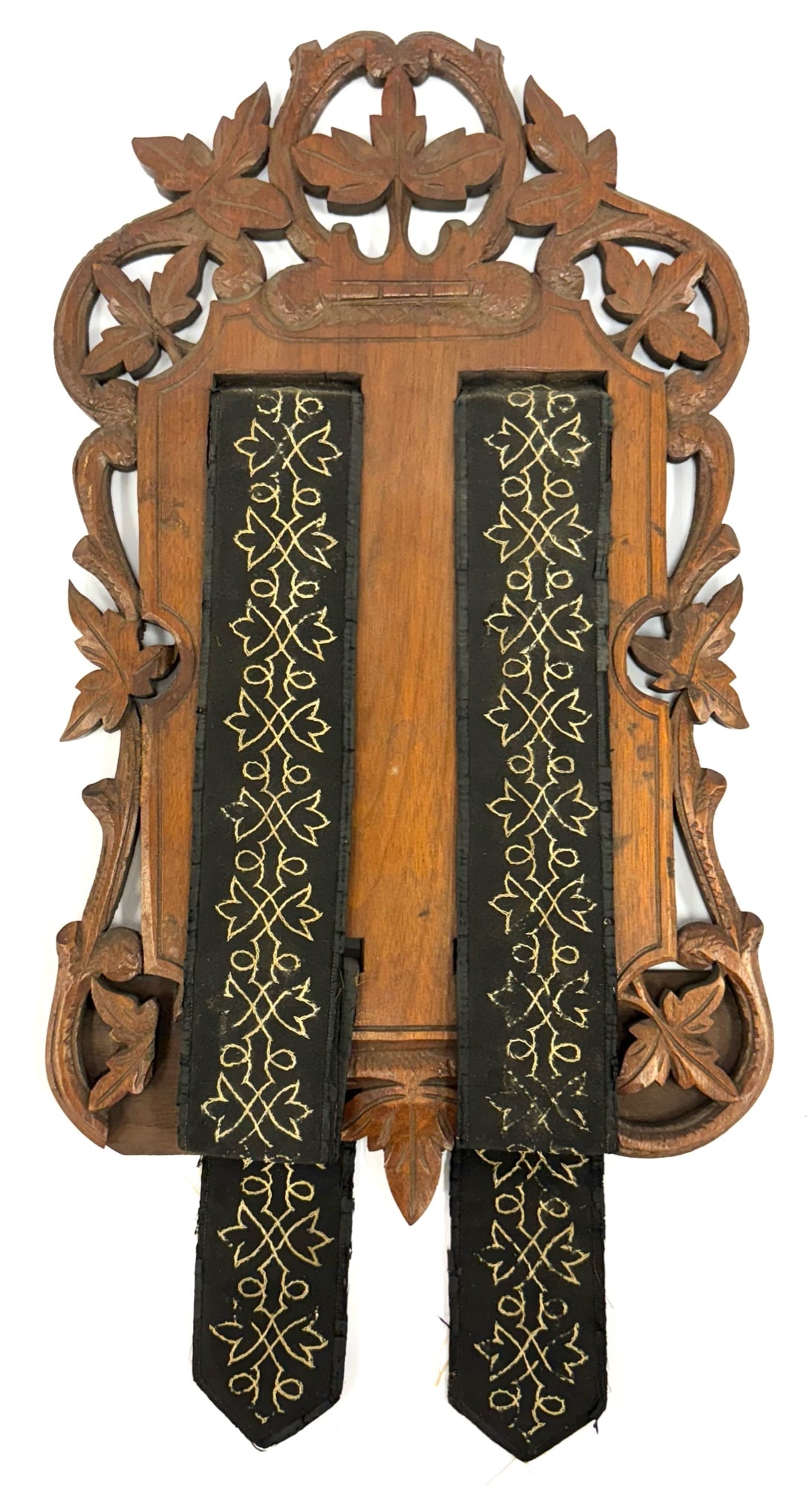 Black Forest Wood Carved Wall Art Decoration: Black Forest Wood Carved Wall Art Decoration.? The Black Forest Wood Carved Wall Decoration is in very nice used condition.? The cloth straps have hand sewed designs and are in very nice used conditio