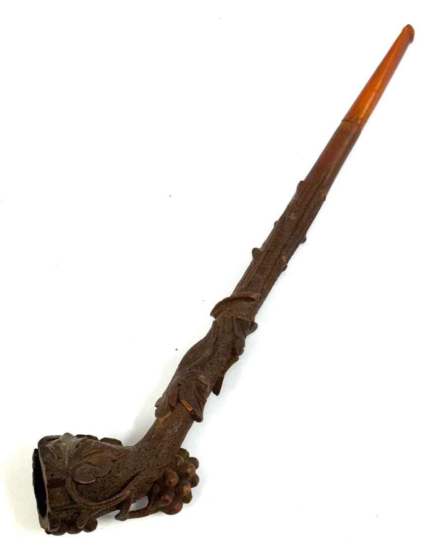 Black Forest Hand-Carved Ornate Smoking Pipe: Black Forest Hand-Carved Ornate Smoking Pipe. This Pipe Is Ornately Carved with Vines, Grape Clusters and Leaves. This Straight Pipe Has A Vulcanized Mouthpiece That Screws Onto The Wooden Stem. There