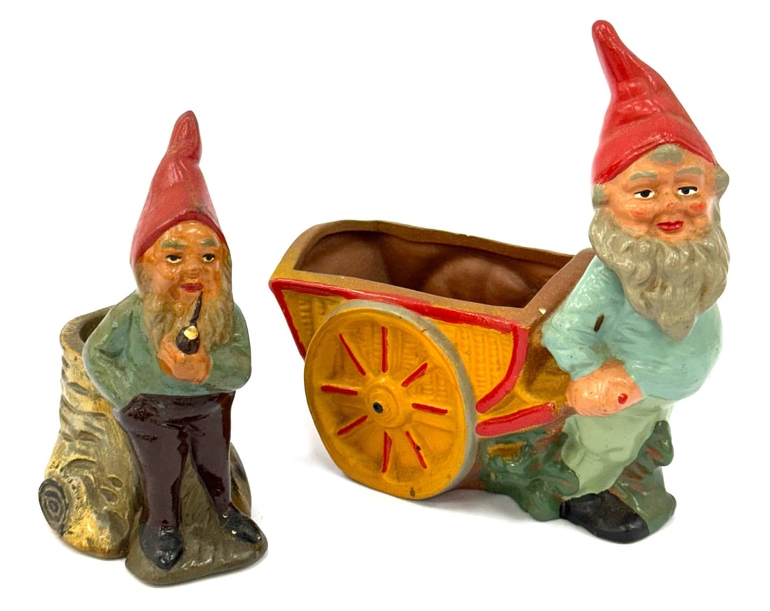 (2) Heissner West Germany Terracotta Gnome Planters: (2) Heissner West Germany Terracotta Gnome Planters.? Both labeled West Germany on the bottom side, largest measuring 6in long.? Both are in good condition with normal wear due to age and display.