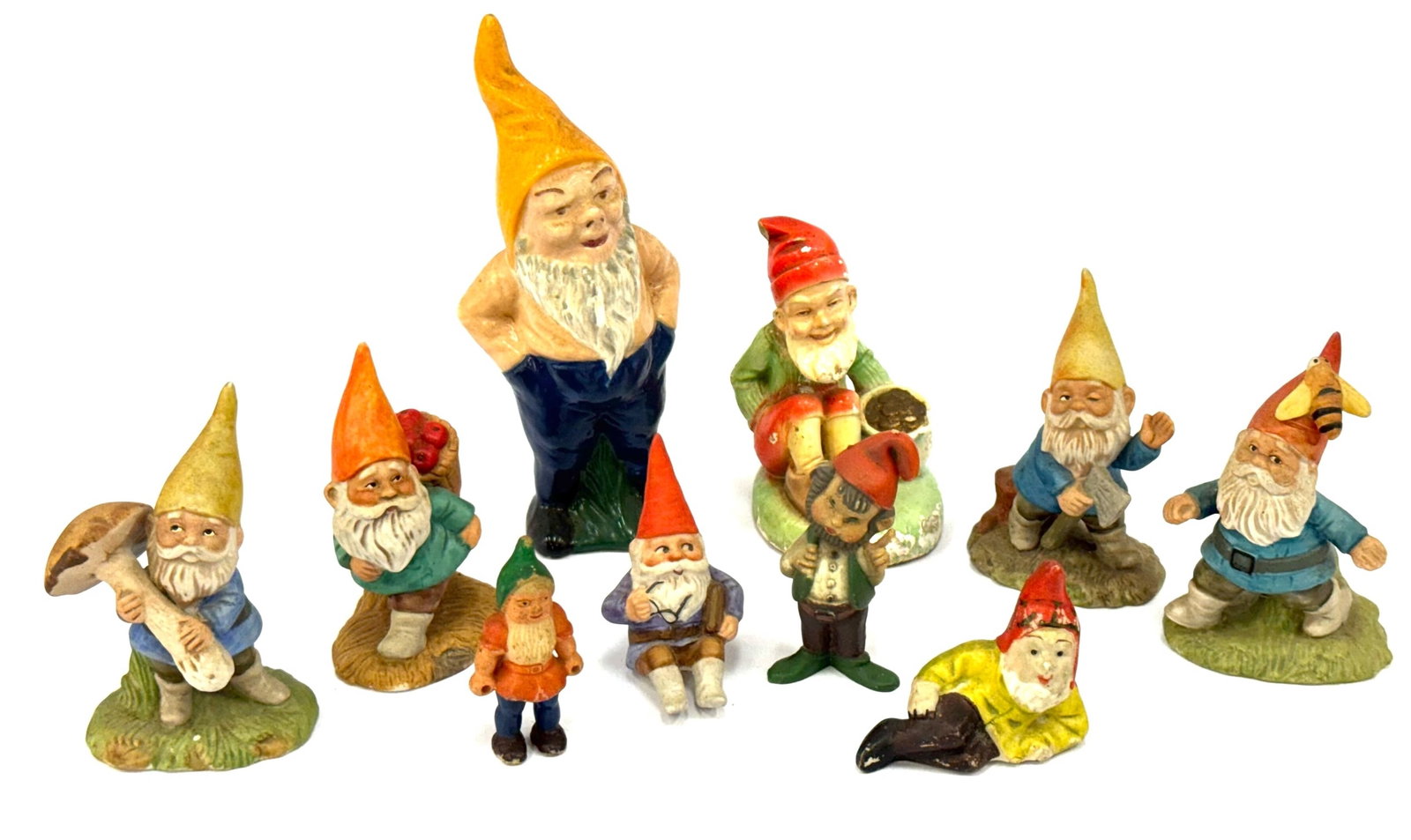 1970's ENESCO Gnome Figurines, and Vtg Bisque and Ceramic: 1970's ENESCO Gnome Figurines, and Vtg Bisque and Ceramic.? Lot contains four ENESCO gnome figures, one Chalkware Sitting Gnome with pot of Gold, and taller Ceramic Gnome.? Tallest measures 7in