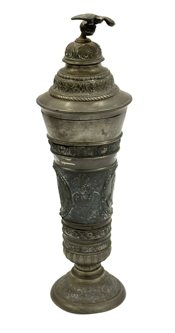 English Renaissance Style Pewter Chalice: English Renaissance Style Pewter Chalice. This Chalice Has The Imperial Eagle Coat Of Arms and Military Silhouettes In High Relief. The Remainder Of The Chalice Has Ornate Scroll Work. The Lid Is Topp