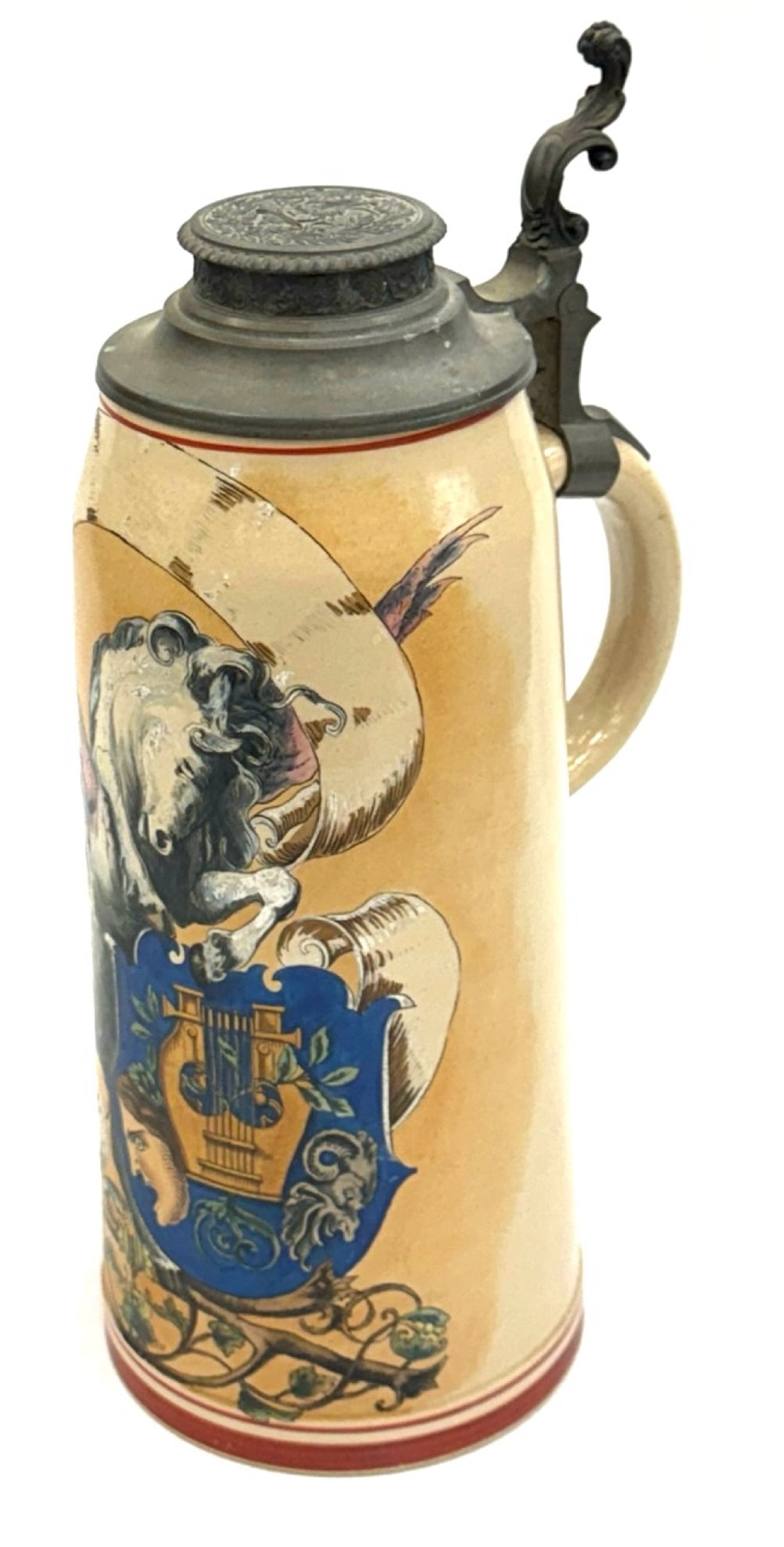 Antique Merklebach Stein with Pewter Lid: Antique Merklebach and Wick Stein with Pewter Lid. This Stein Has A Pink-Winged Pegasus and A Royal Crest On The Exterior. The Maker's Mark Is Easily Visible On The Bottom. The Ornate, High Relief Pew