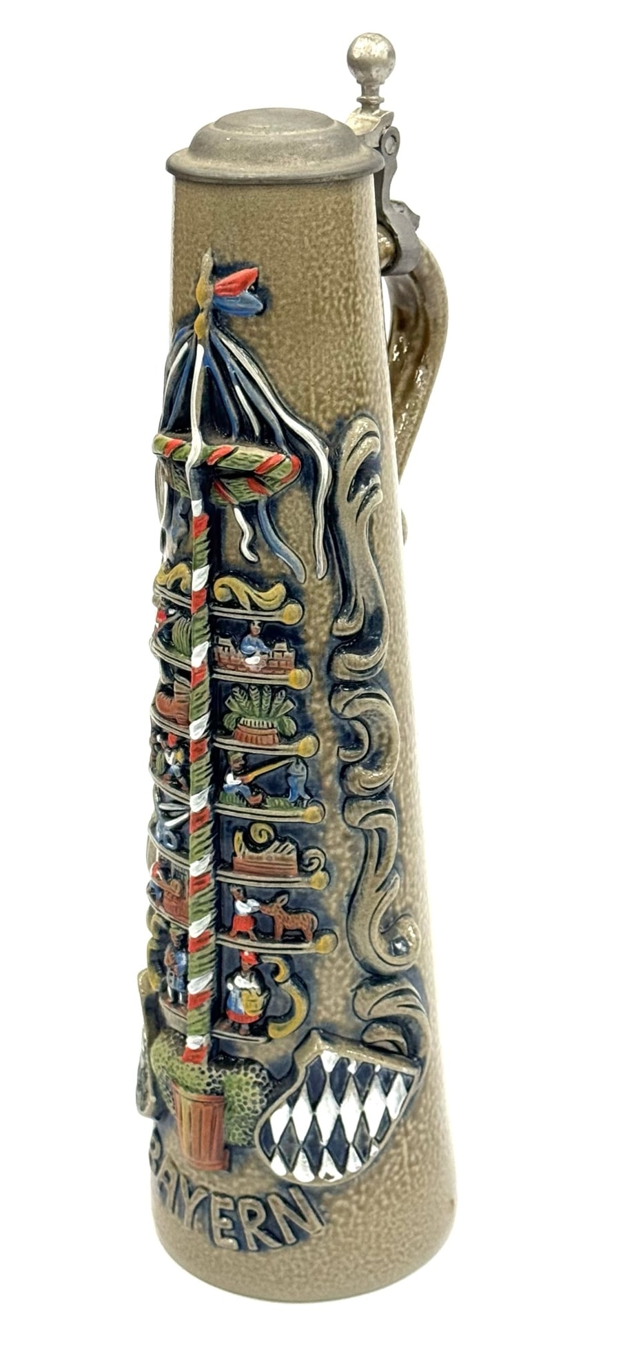 German Bavarian Original King Bayern Maypole Stoneware Stein: German Bavarian Original King Bayern Maypole Stoneware Stein. This 1 Liter Stein Has A Unique Shape and High Relief Design. King Bayern's Flagpole, As well As The Royal Crests Are Hand Painted and Det