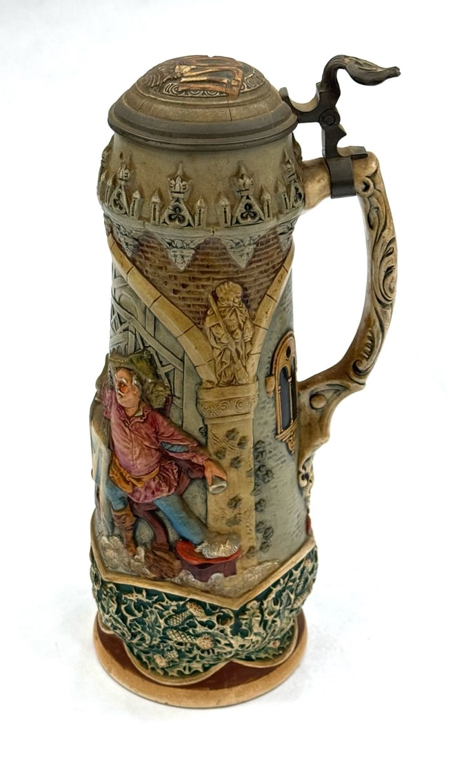 1.5 Liter German Dumler & Breiden Stein with Domed Ceramic Inlayed Lid: 1.5 Liter German Dumler & Breiden Stein with Domed Ceramic Inlayed Lid. This Stein Is Quite Ornate and In High Relief. It Features Two Gentlemen Sharing A Drink At A Table. The Domed Ceramic Lid Says 