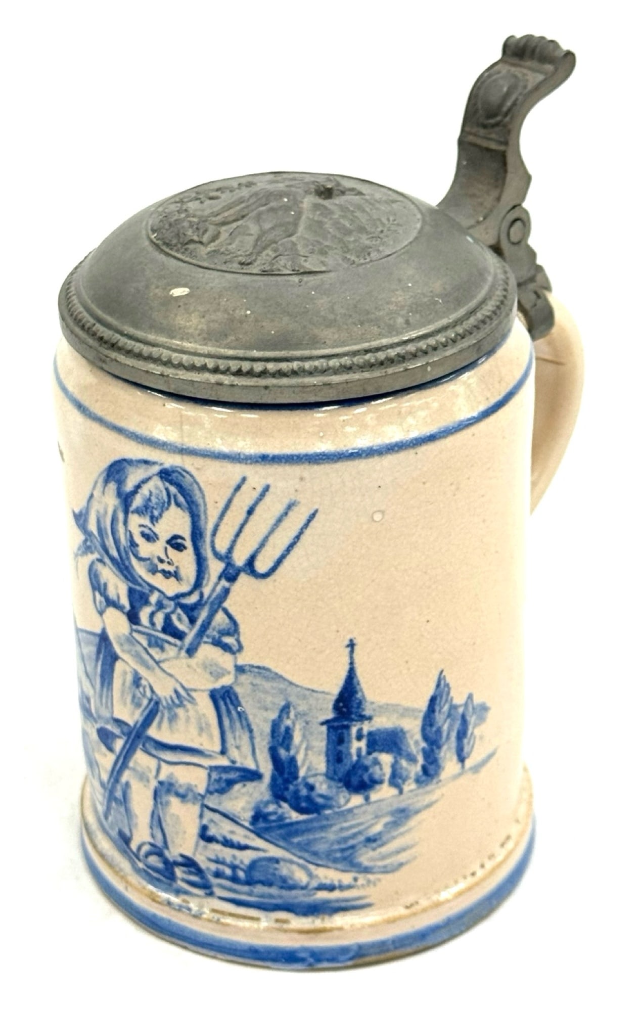 Bavarian Delft-Style 0.5 Liter Stein with Pewter Lid.: Bavarian Delft-Style 0.5 Liter Stein with Pewter Lid. This Unique Stein Depicts A Young Girl Holding A Pitch Fork. The Domed Pewter Lid Has A Wolf In High Relief. There Are No Cracks Or Chips Visible.