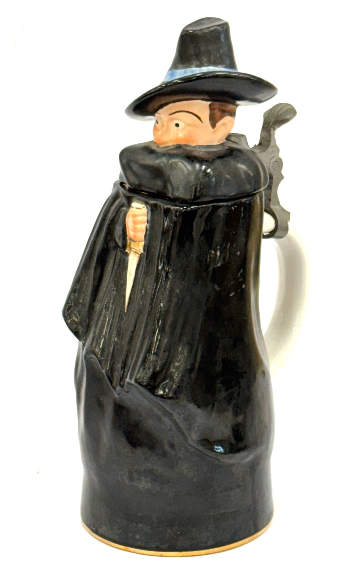 Vtg. German Porcelain Cloak & Dagger Music Box Stein: Vtg. German Porcelain Cloak & Dagger Music Box Stein.? Measuring 9.5in tall and free of chips and cracks.? Made in Germany plays Dritter Mann