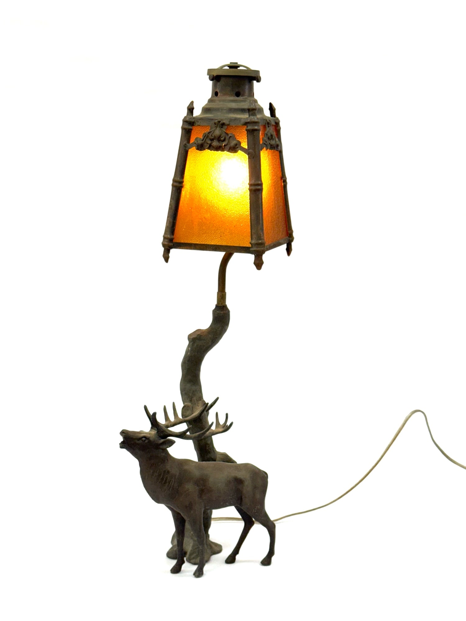 Antique Stained Glass Bull Elk Cast Iron Lamp: Antique Stained Glass Bull Elk Cast Iron Lamp.? The stained glass bull elk lamp is in very nice used condition.? Lamp stands 24 inches tall.? The stain glass is a burnt yellow color and is beautiful.?