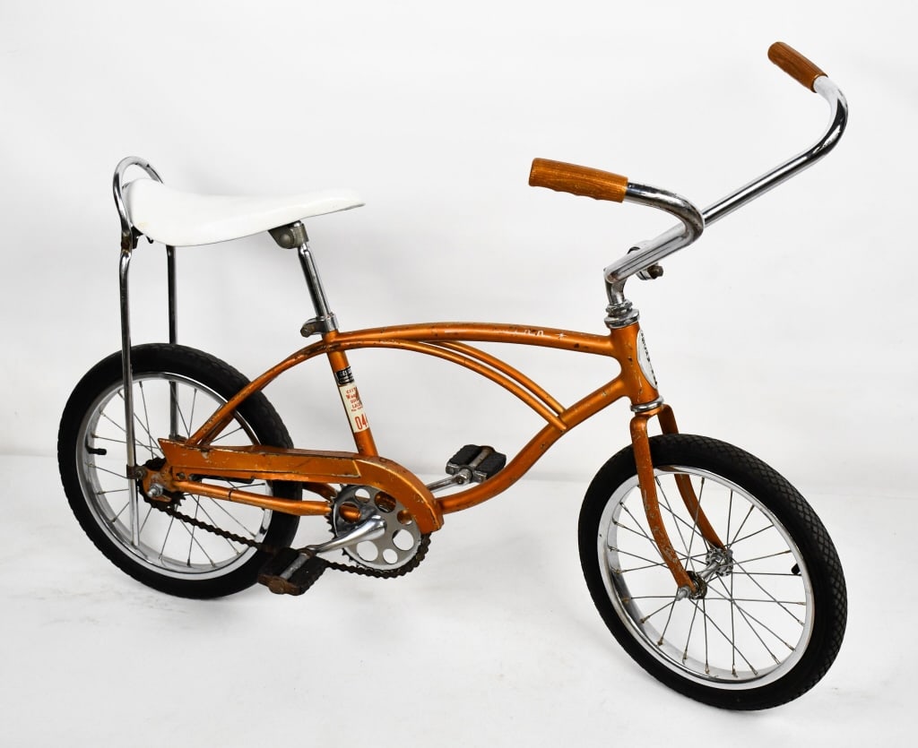 *1967 Schwinn Midget Sting-Ray Bicycle: 1967 Schwinn Midget Sting-Ray Bicycle. The bike features banana seat and Schwinn sparkle handlebar grips. It has paint loss, surface rust, and wear from use and age. Serial number #CC18503 * All bikes