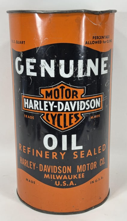 Vintage Harley-Davidson Promotional Trash Can: Vintage Harley-Davidson metal trash can that resembles an oil can. Can has paint loss, dents, scratches, and wear from use and age. IT measures approximately 19in tall by 10-1/2in in diameter.