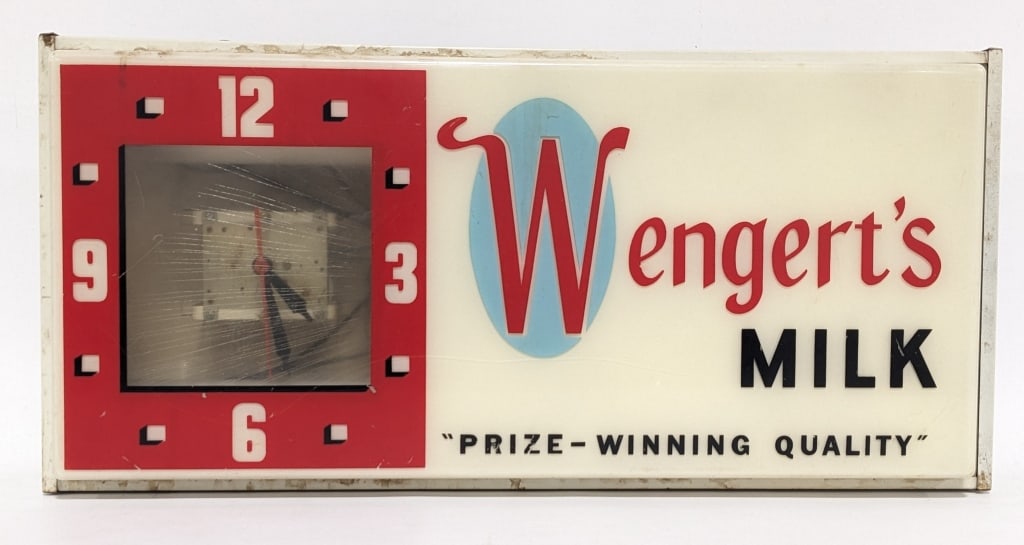 Vintage Wengert's Milk Lighted Advertising Clock: Vintage Wengert's Milk lighted advertising clock by G.P. Gundlach & Co. The clock has a plastic face and metal can, the clock is missing the face. Good condition with age and display wear. Measures 11