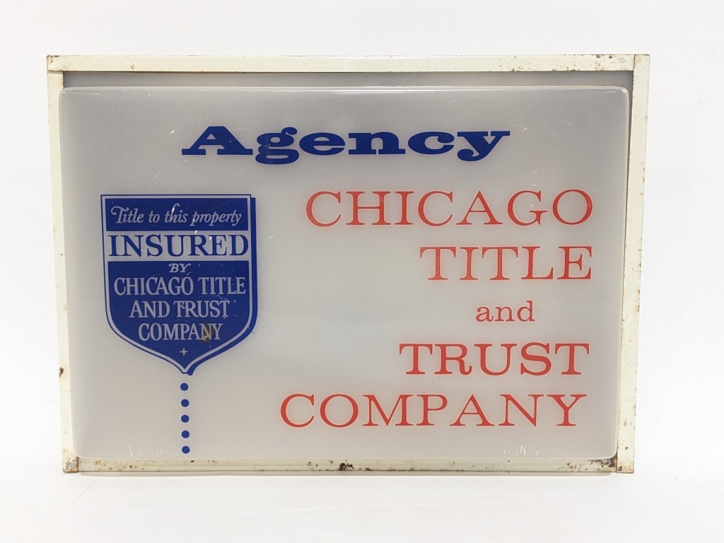 Vintage Chicago Title & Trust Company Lighted Sign: Vintage Chicago Title and Trust Company lighted advertising sign. The sign lights and is in good condition with some age and use wear. Plastic front with metal can. Measures approximately 13" tall x 1