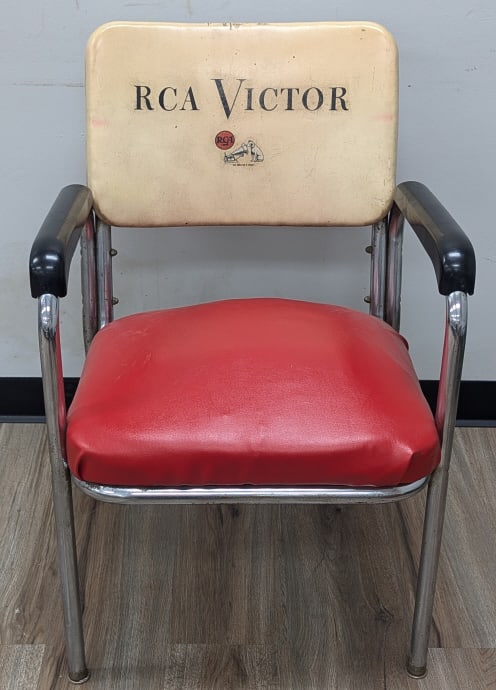 Vintage RCA Victor Advertising Chair: Vintage RCA Victor advertising chair. The chair has a chrome frame with the original advertising back rest, the seat has been recovered. The condition is good with some age and use wear. Measures appr