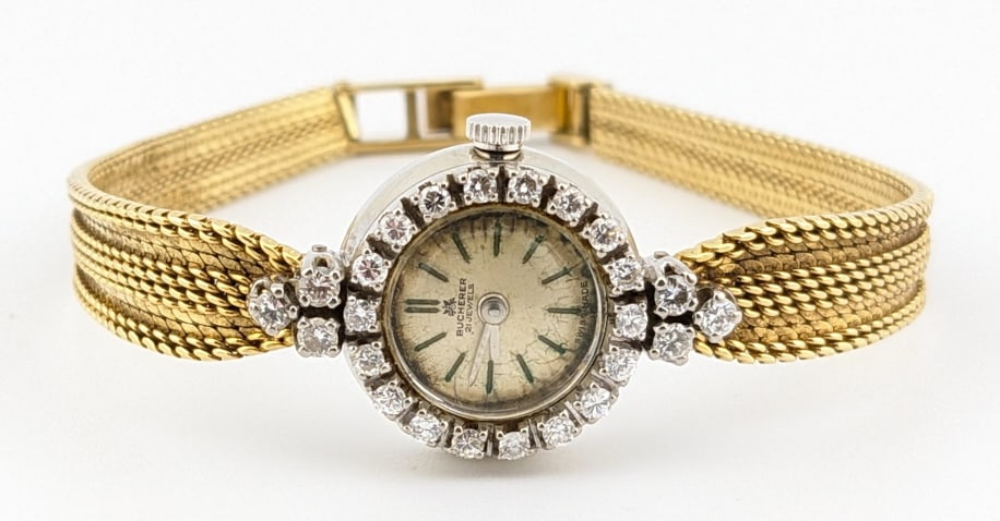 Ladies Bucherer 18K Gold Diamond Wristwatch: Ladies vintage Bucherer 18K white gold case & 18K yellow gold band Swiss Diamond Wristwatch. The watch has a 21 jewel mechanical movement and is in nice condition, runs well. The watch features 24 gen