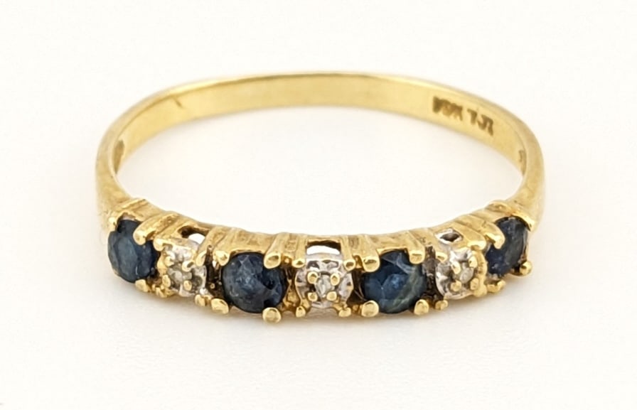 10K Yellow Gold Sapphire and Diamond Band Ring: 10K Yellow Gold Sapphire and Diamond Band Ring. The ring size is 6.5 and the total weight is 1.1 grams.