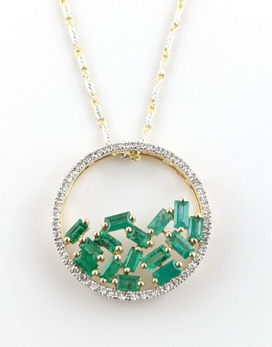 14K Gold 1.17ctw Emerald and Diamond Necklace: 14K Yellow Gold 1.17ctw Emerald and Diamond Necklace. 15 baguette cut emeralds are surrounded by round brilliant cut diamonds. The emeralds weigh 0.95ct and the diamonds weigh 0.22ct. The necklace is 