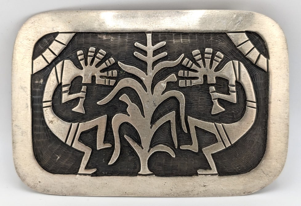 Sterling Native American Hopi Kokopelli Buckle: Sterling Native American Hopi Kokopelli Belt Buckle. The buckle features Kokopelli, a fertility deity who plays the flute. It measures 3in length x 2in width. The total weight is 41.8 grams.
