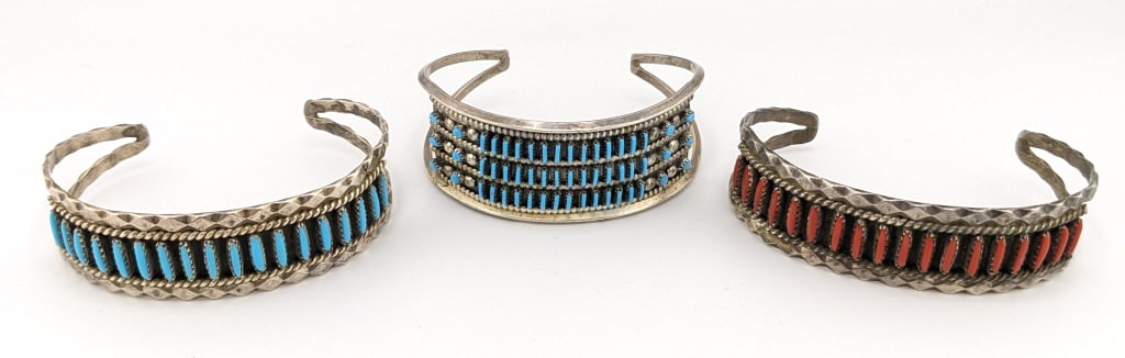 (3) Sterling N.A. Turquoise and Coral Cuffs: (3) Sterling Native American Turquoise and Coral Cuff Bracelets. They measure 2-1/4in to 2-5/8in length and 3/4in to 1in width. The total weight is 65.5 grams.