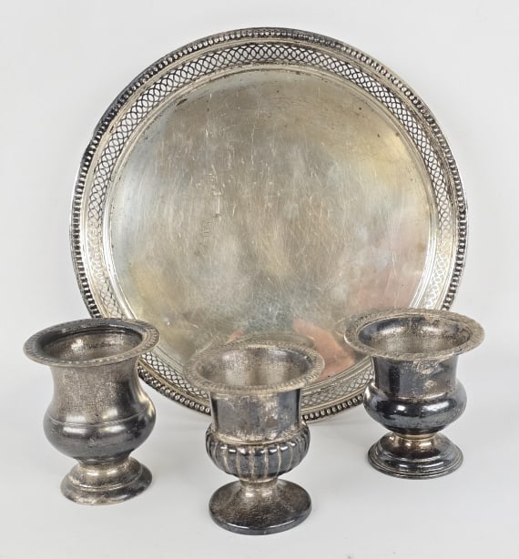Mixed Lot Of Four Sterling Silver Holloware Pieces: Mixed lot of four unweighted sterling silver holloware pieces. Brands include Inernational, Wallace, Fisher, and more. Lot includes three approx. 3' tall egg cup urns and a 8-3/8" diameter round tray.