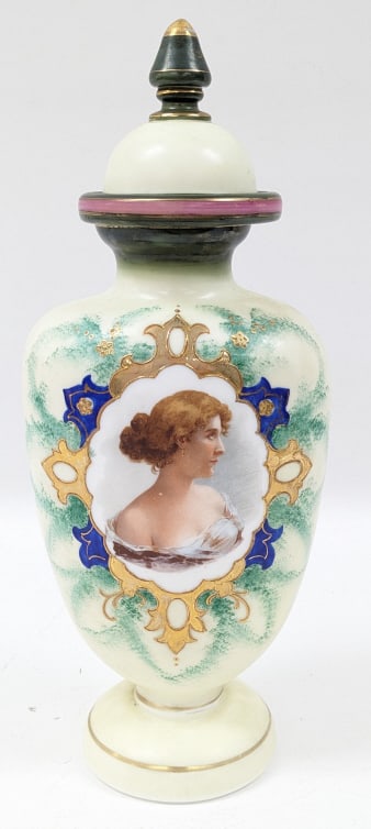 Antique Bristol Custard Glass Portrait Bottle: Antique Bristol Custard Colored Glass Portrait Bottle. The bottle is in nice condition with some wear to the gold paint. It measure approximately 16-1/2" tall x 6-1/2" across. Marked with a "3" on the