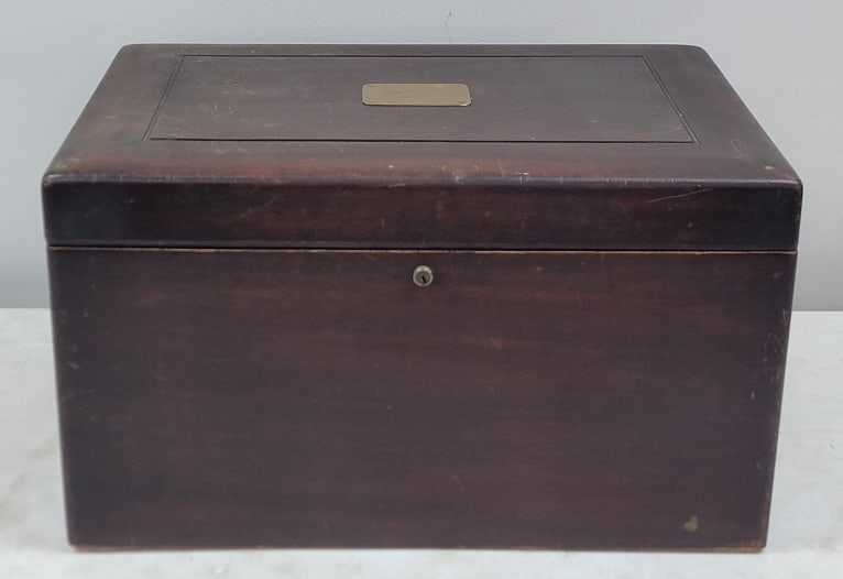 Large Antique Mahogany Humidor: Large Antique Mahogany Humidor. The humidor is lined in milk glass, the bottom section is cracked. and has brass handles. It is in nice condition with some age, use, and storage wear. Measures approxi
