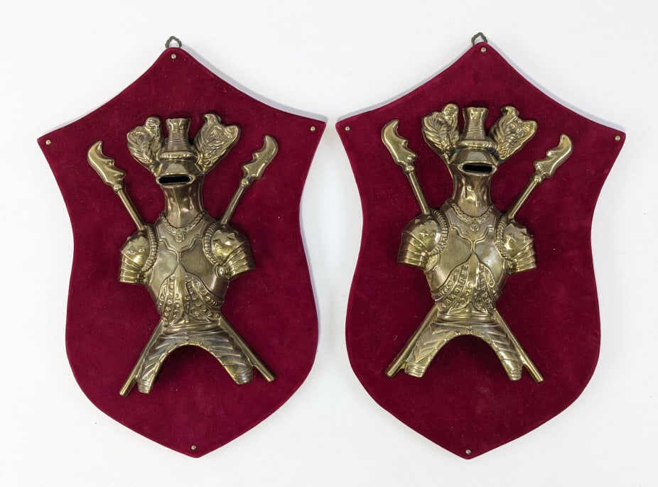 Pair Of Coat Of Arms Shields On Velvet: Pair of vintage brass Coat of Arms Shields on velvet. Nice condition with great detail. They measure approximately 14-3/4" tall x 10-1/4" across.