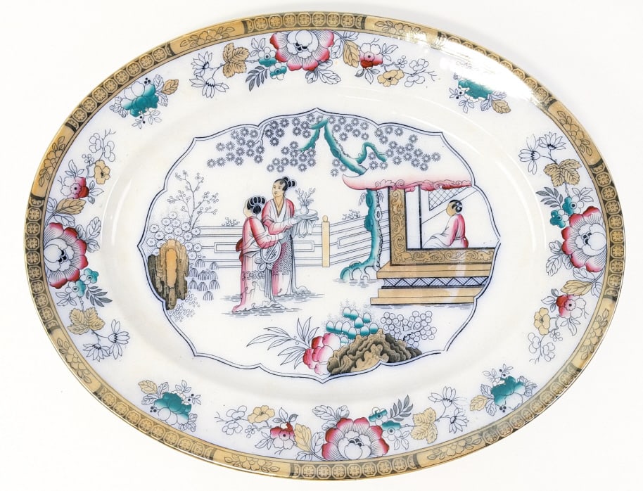 Antique Ashworth England Chinese Ironstone Platter: Antique Ashworth England ironstone platter with a Chinese Garden design. The platter is in nice condition with crazing. Measures 18-3/4" across x 15" wide.
