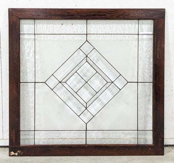 Antique Beveled Leaded Glass Framed Panel: Antique beveled leaded glass panel in an oak frame. Nice condition with an elegant design. Overall measures 39-1/4" tall x 41-1/2" across x 1" deep.