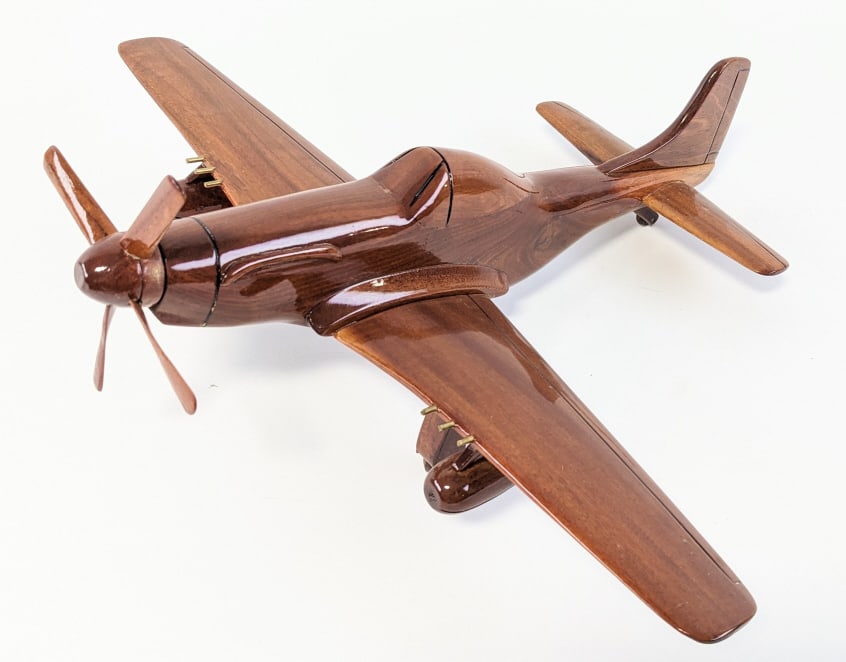 P-51 Mustang Mahogany Desktop Airplane: P-51 Mustang Mahogany Desktop Airplane. The plane comes on a stand and displays great. Measures 5-1/2" tall x 16" across with a 18" wingspan.