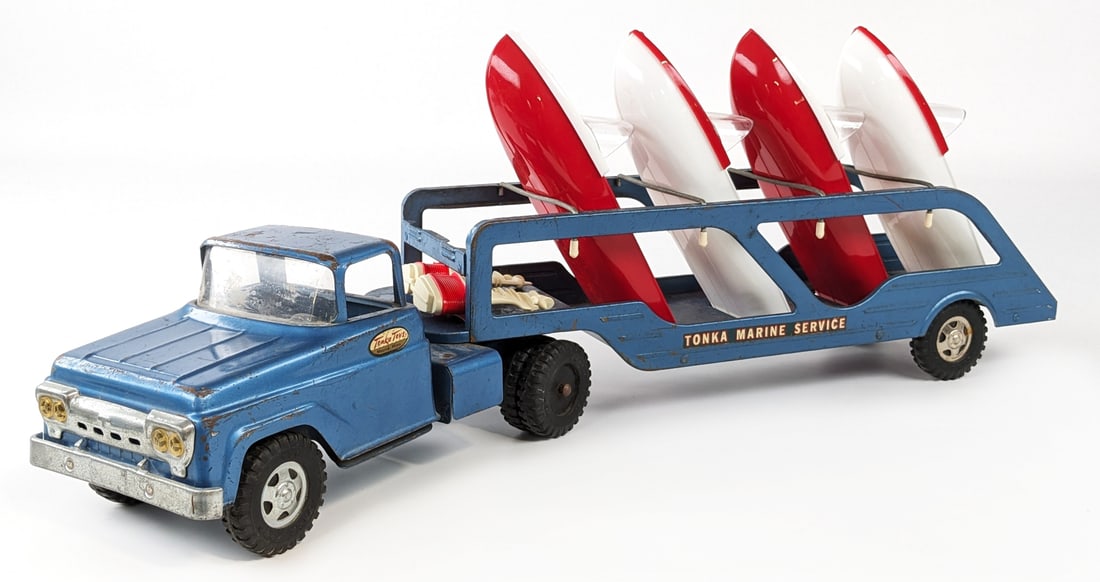 Tonka Marine Service Boat Transport Truck w/ Boats & Outboard Motors: Tonka Marine Service Boat Transport truck. The truck and trailer are original and the boats and outboard motors are correct replacements. The truck is missing one hubcap, has paint loss, and surface r