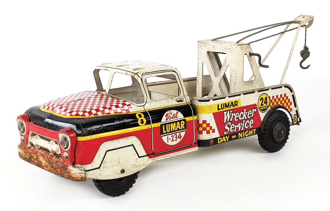Marx Lumar Wrecker Service Day or Night Tow Truck: Original Marx Lumar Wrecker Service Day or Night wrecker tow truck. The truck has some surface rust, discoloration, and wear from play / age. Displays well with good graphics. Measures approximately 2