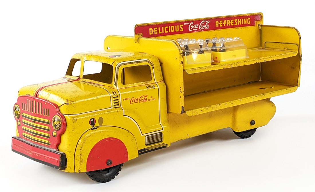 Marx Coca-Cola Delivery Truck: Original Marx Coca-Cola delivery truck. The truck has some paint loss, rub marks, discoloration, and age wear. Measures approximately 12" long.