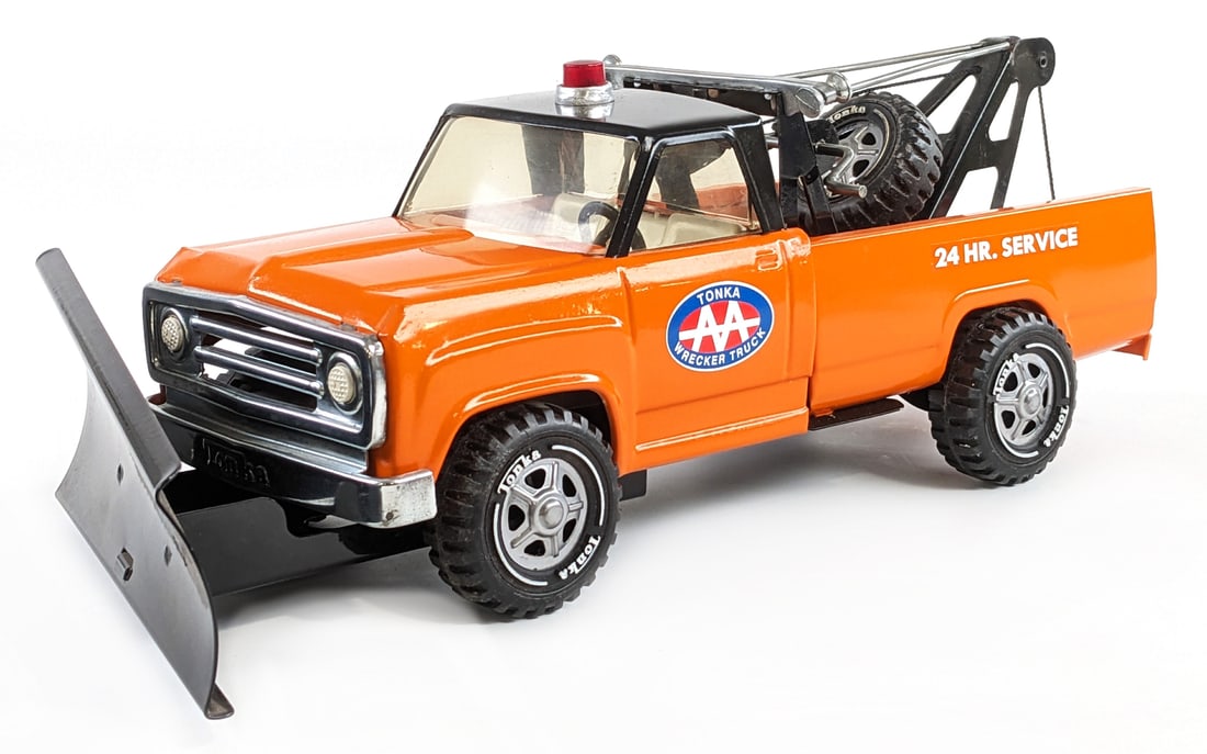 Custom Tonka Dodge Wrecker Truck w/ Snow Plow: Custom Tonka Dodge wrecker truck with snow plow. The truck is in good condition with a nice custom paint job. Measures approximately 17" long.