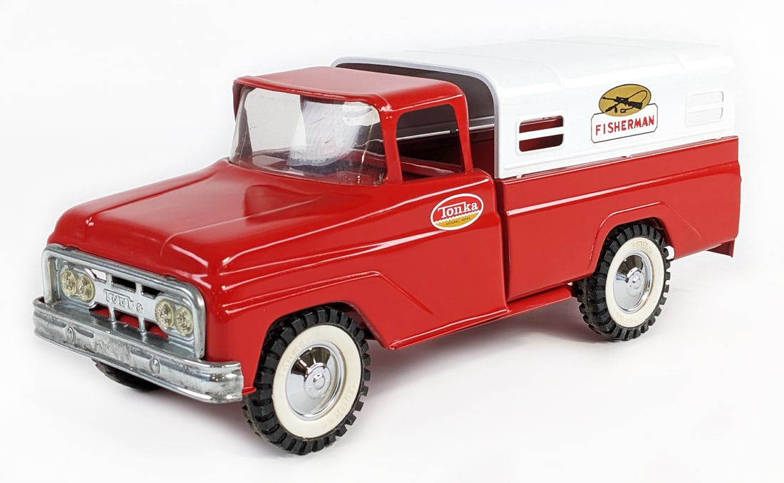 Restored Tonka Fisherman Truck: Restored Tonka Fisherman truck. The truck displays well in red with a white bed topper and chrome hubcaps. Good condition with a nice paint job. Measures approximately 14" long.