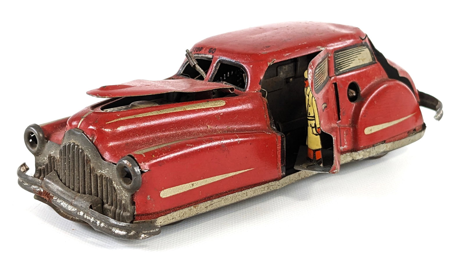 Joustra Tin Windup Miracle Car: Joustra tin windup miracle car. The car is missing the key so the windup is untested. The door and hood don't close very well. The car has paint loss, surface rust, and wear from play / age. Measures