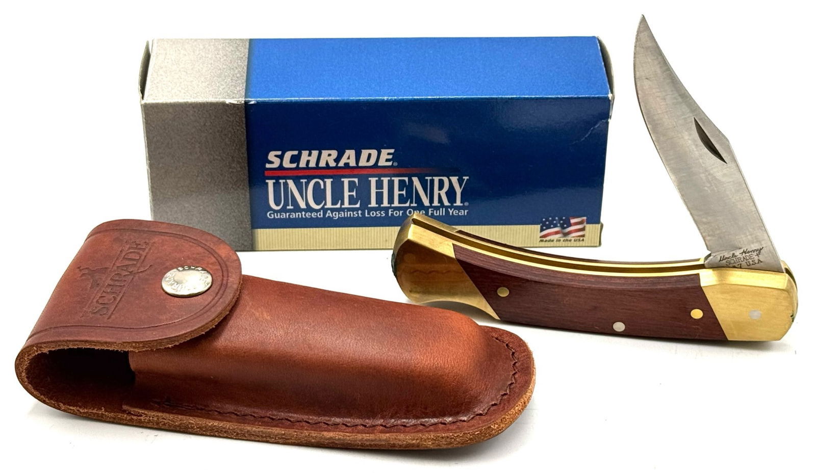 Schrade USA Uncle Henry LB7 Bear Paw Lock Back Pocket Knife NIB: Schrade USA Uncle Henry LB7 Bear Paw Lock Back Pocket Knife NIB.? NOS for sure, box contains paperwork and sheath.? Blade measures 4 3/8 inches in length.? A great knife with a quality name.?