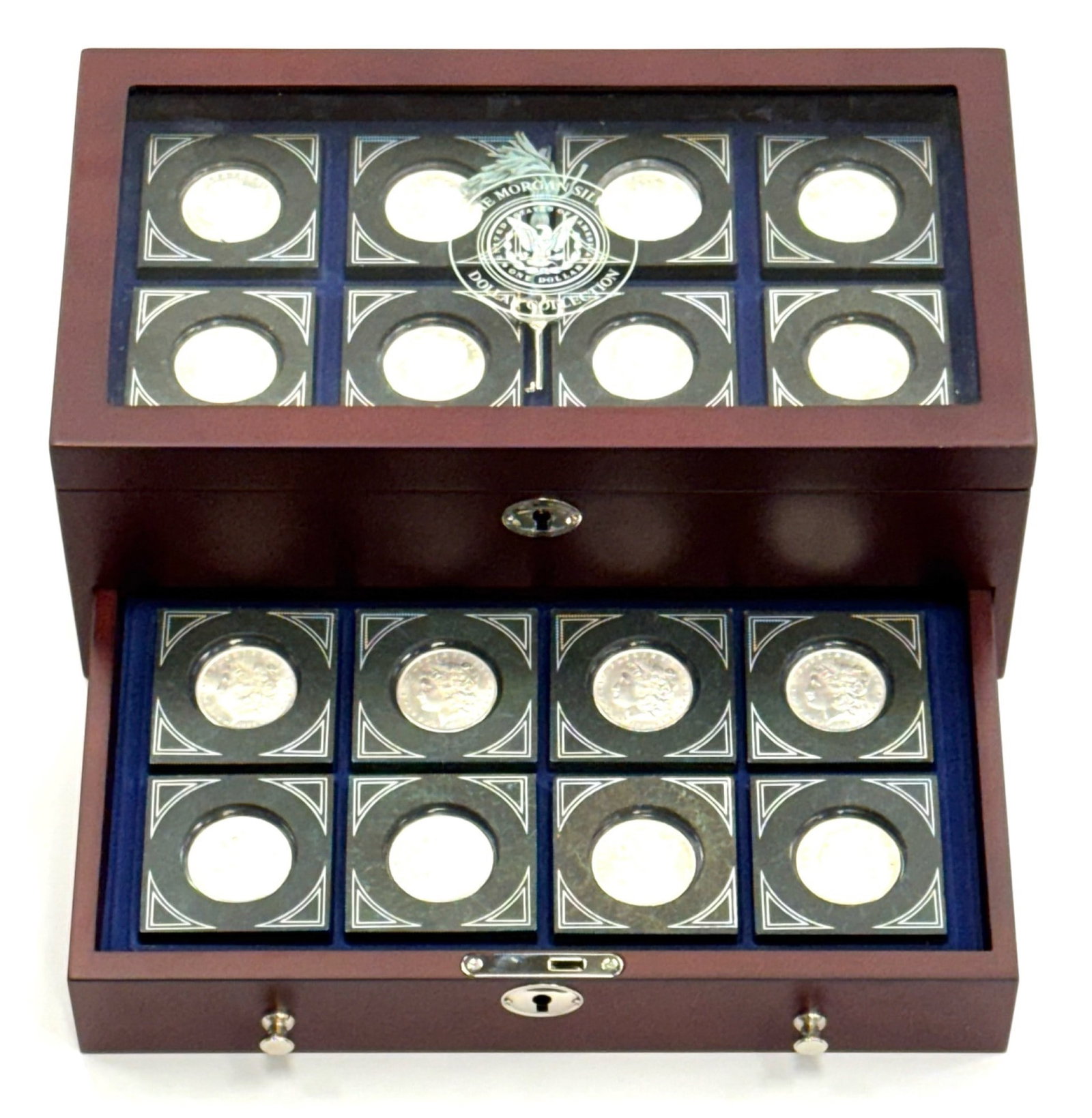 16pc U.S. Morgan Silver Dollar Collection in Display Case: 16pc U.S. Morgan Silver Dollar Collection in Display Case, case measures approximately 14in x 8in x 5.5in.? Total FV $16.00 and This lot includes the following U.S. Silver Morgan Dollars: 1883 1898 18