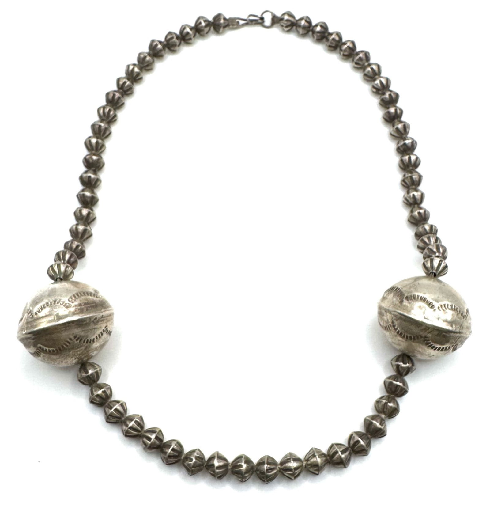 Sterling Navajo Native American Beaded Necklace: Sterling Navajo Native American Beaded Necklace with stamped puffed silver beads.? Measures 18in long, unmarked weighs 33.06g