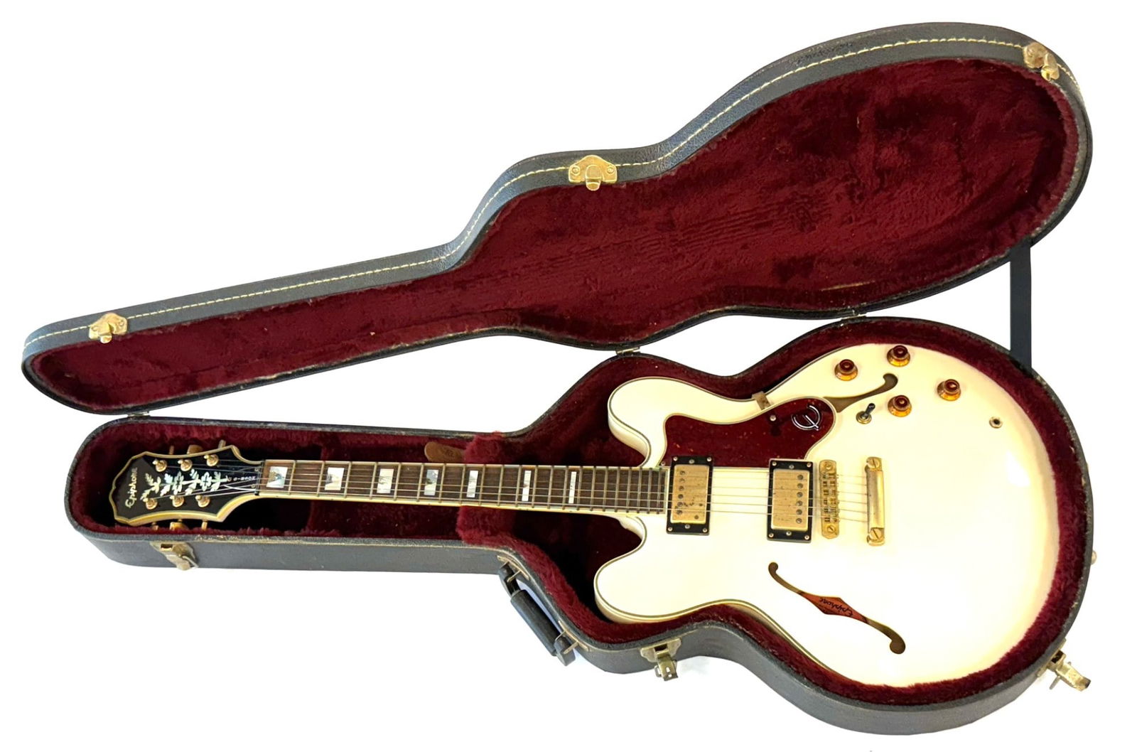 Epiphone Sheraton Semi-Hollow Electric Guitar: Epiphone Sheraton Semi-Hollow Electric Guitar. This semi-hollow electric guitar is a 6-string guitar made in the 1950s with the original hardcase included from Epiphone. The guitar along with the six