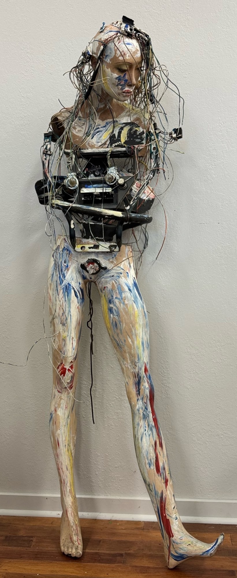 Abstract Painted Mannequin Car Part Original Art Sculpture: Abstract Painted Mannequin Car Part Original Art Sculpture.? This unique sculpture combines a lady mannequin that is paint splattered and various old car parts including steering wheel, review mirror,