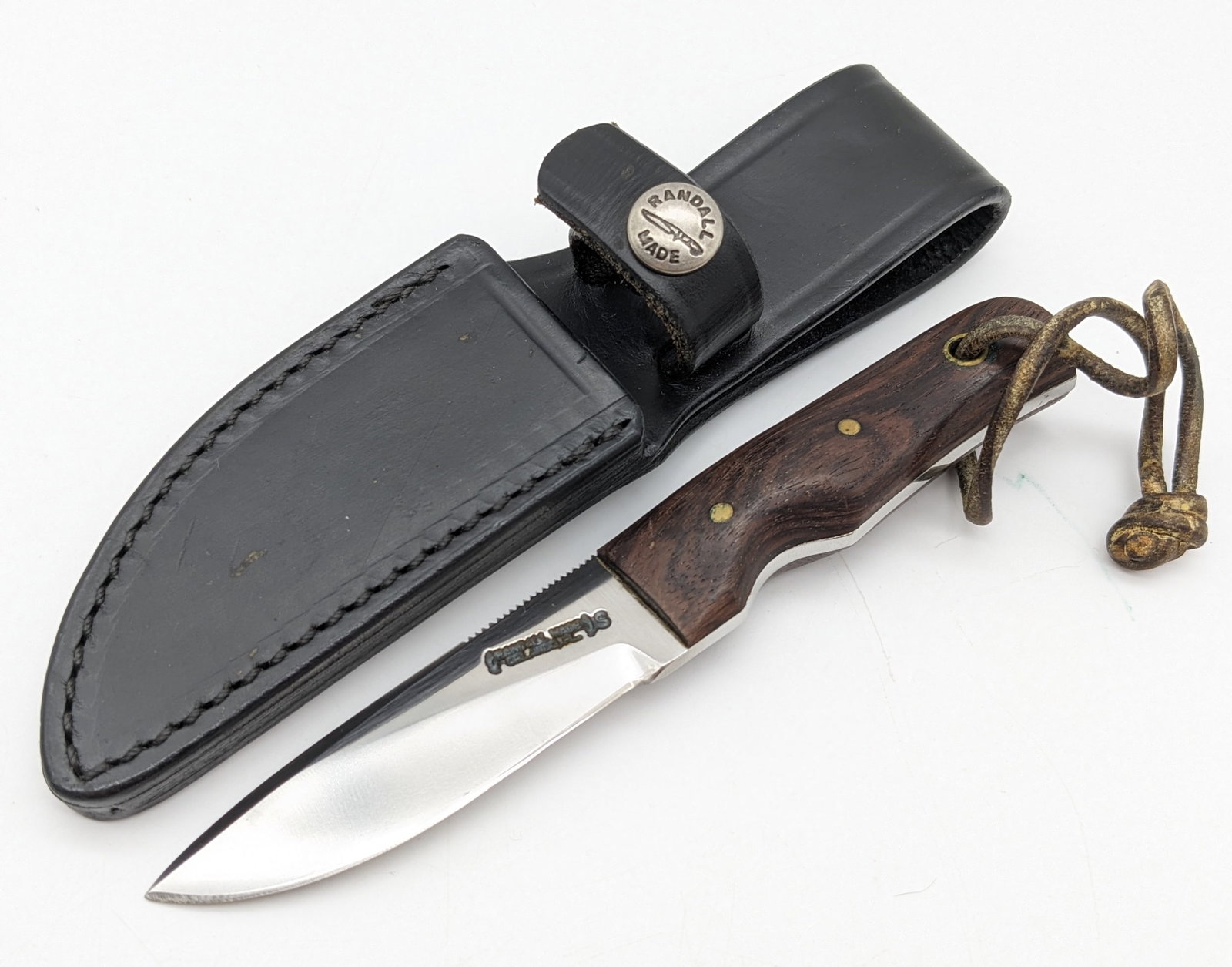 Randall Model 10 3in Household Utility Knife w/ Sheath: Knife is in nice condition with minimal wear from some light use. Features a stainless steel blade with thumb notches, and Mexican Desert Ironwood handle scales. Comes with the Randall leather sheath.