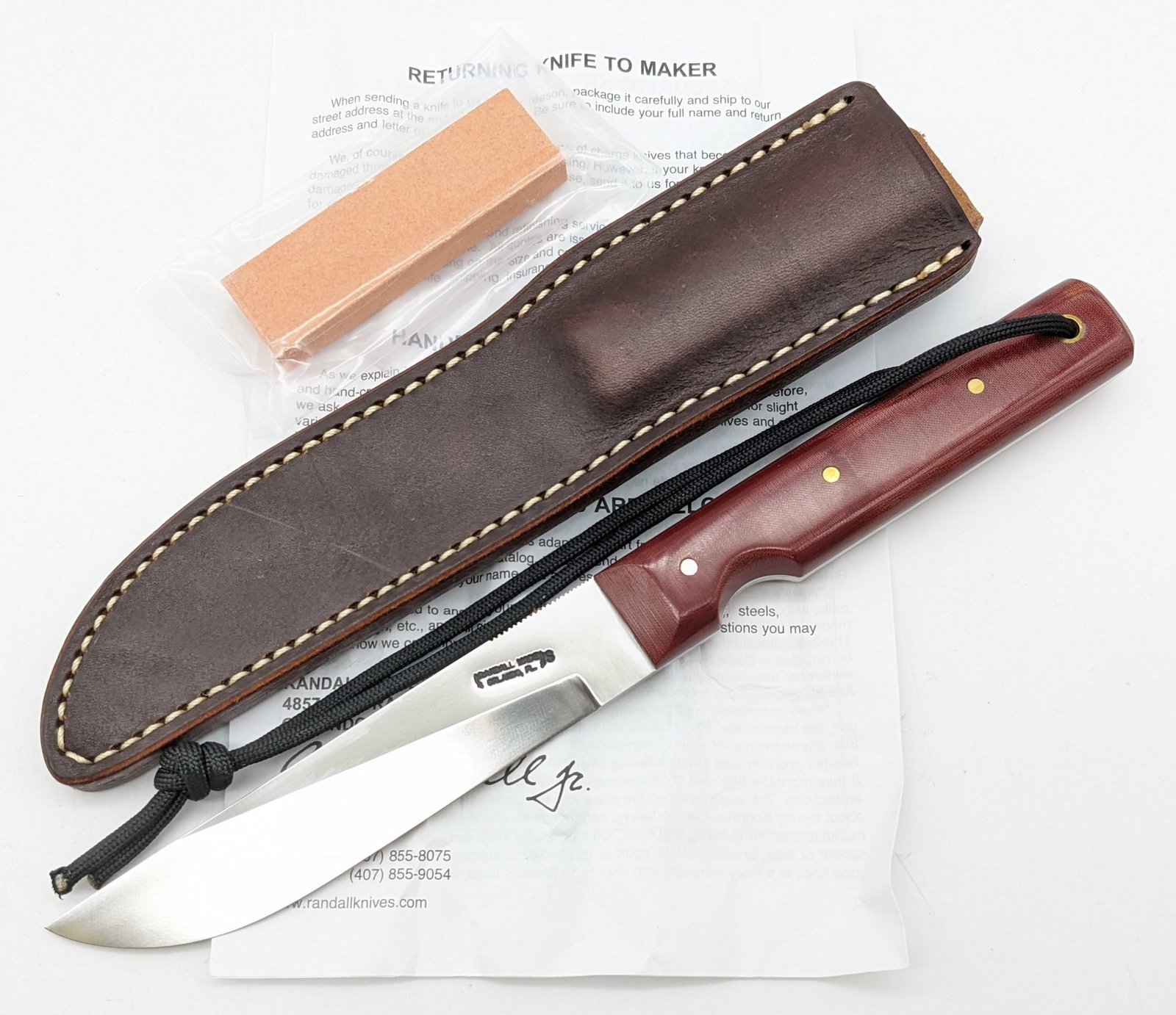 Randall Model 10 Red Micarta Fisherman Household Utility Knife w/ Sheath, Stone, & Papers: Knife is in new condition. Features a stainless steel blade with thumb notches, and red micarta handle scales with a finger groove and lanyard hole. Comes with the Randall leather sheath, the sharpeni