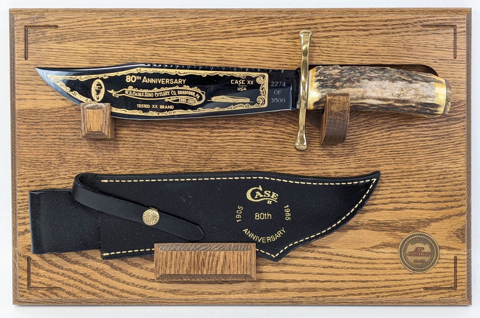 Ltd 1985 Case XX 80th Anniversary Blued Finish Stag Bowie Knife w/ Sheath & Plaque: Knife is numbered 2274 of 3000 and features a blued finish blade with gold etching, brass double guard, stag handle, and brass butt cap. Knife is in very nice condition with some light scuffs on the b