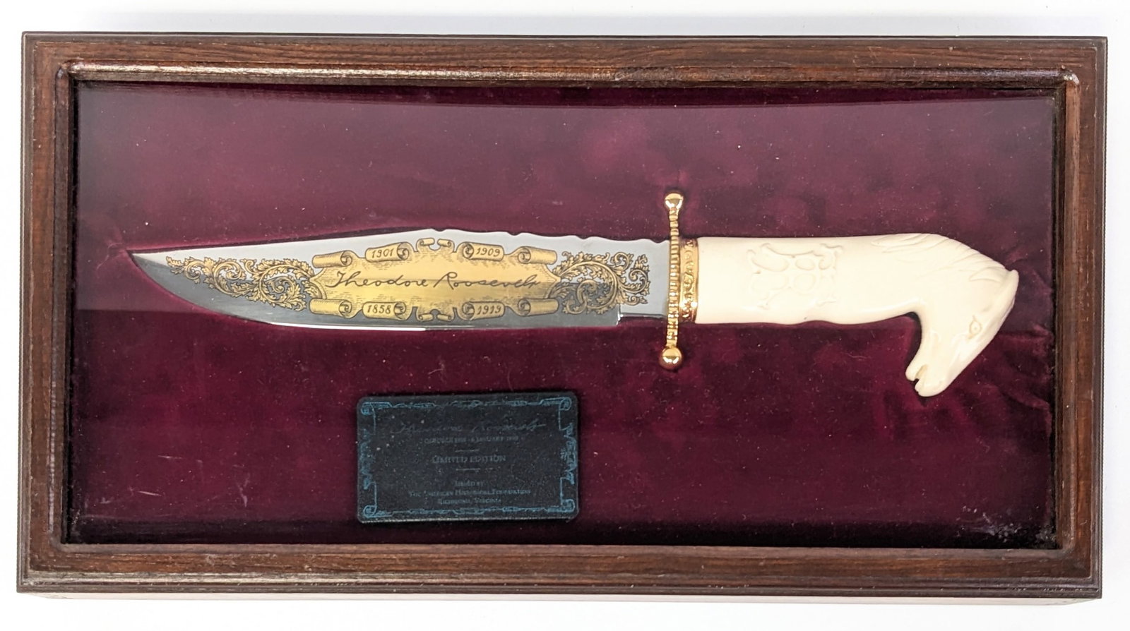 H.G. Long American Historical Foundation Theodore Roosevelt Bowie Knife w/ Case: Knife is numbered 2408 and features a mirror polished bowie blade with gold gilt scroll etchings of Theodore Roosevelt, file work along the spine, file worked ball end brass double guard, and white pl
